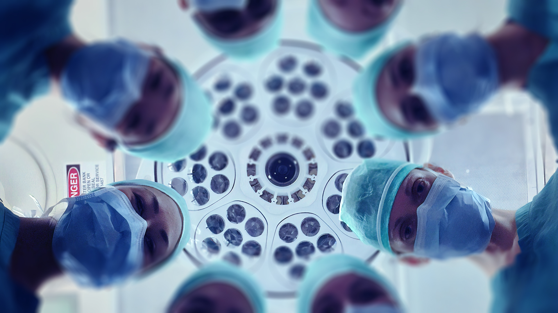 Doctors' faces looking down.